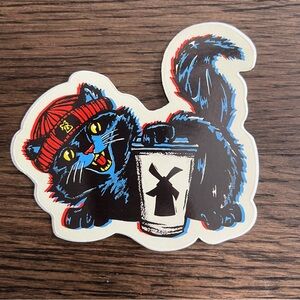 Dutch Bros Black Cat Sticker with Red Beanie and Yellow Eyes